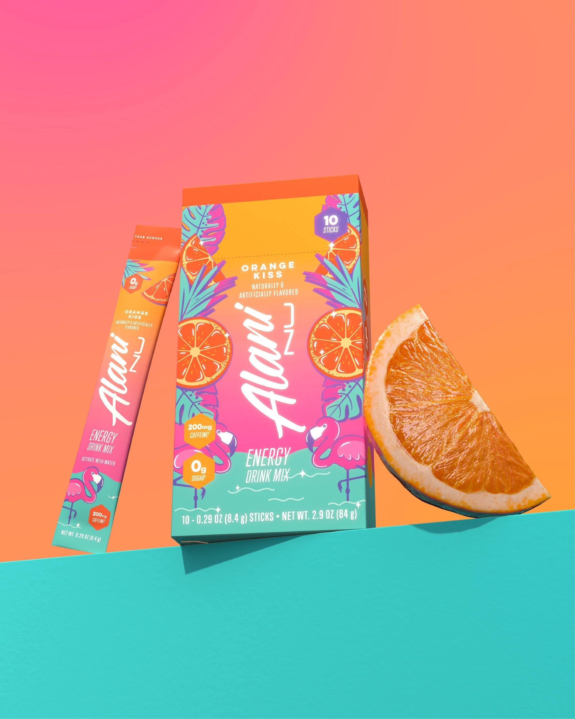 An orange wedge, an Orange Kiss Energy Stick, and its 10-pack carton grouped on a seafoam shelf.