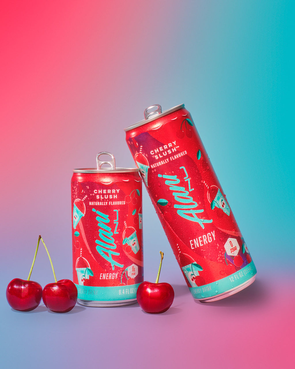 A couple of Cherrries next to Mini Energy and regular size Energy Drink in Cherry Slush flavor.